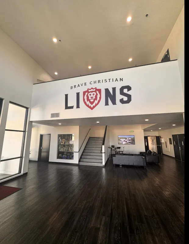 Brave Christian LIONS lobby mural painted by Trinity