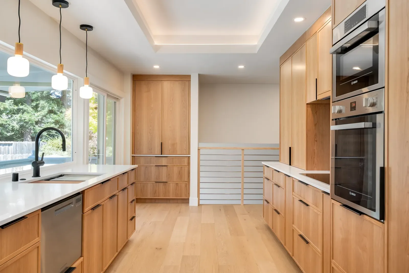 Modern natural wood kitchen in San Ramon by Caliber Cabinets