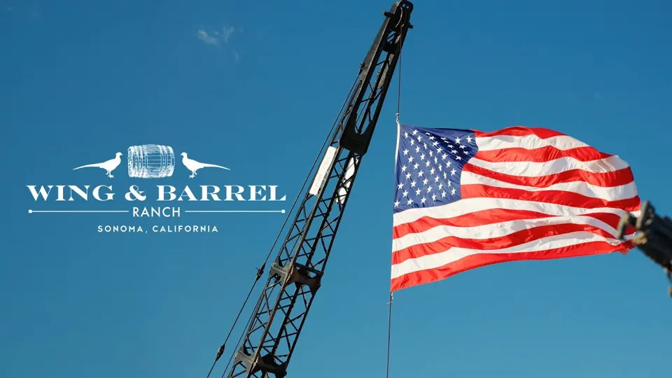 An American flag flying over Wing and Barrel Ranch