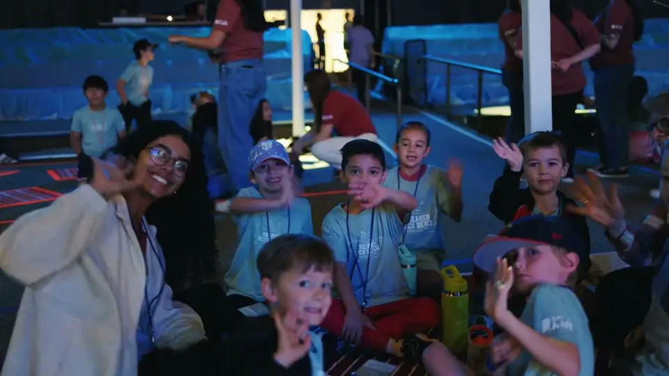 Kids cheering at vacation Bible school